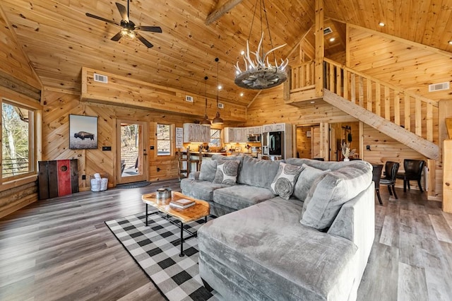 87 Lonesome Dove Path, Blue Ridge, GA 30513 - living area featuring wooden walls, high vaulted ceiling, a ceiling fan, wooden ceiling, and light wood-style floors
