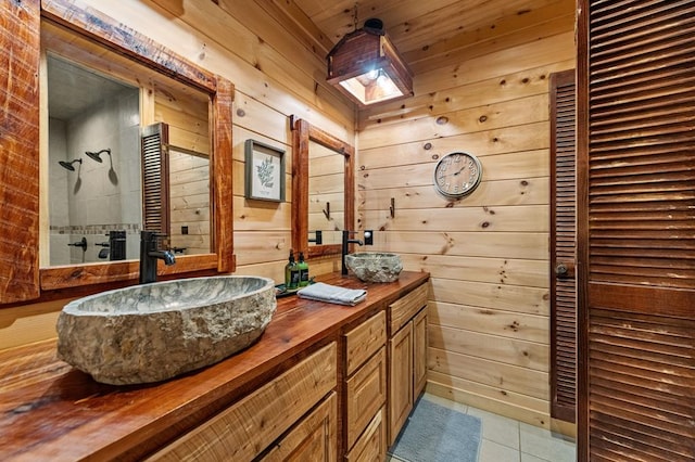 87 Lonesome Dove Path, Blue Ridge, GA 30513 - bathroom with tiled shower, tile patterned floors, double vanity, and wood walls