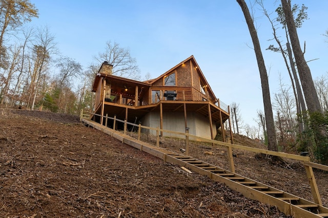 87 Lonesome Dove Path, Blue Ridge, GA 30513 - rear view of house with a wooden deck, a chimney, and log veneer siding
