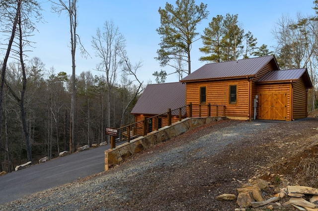 87 Lonesome Dove Path, Blue Ridge, GA 30513 - view of front of home featuring metal roof, driveway, and log veneer siding