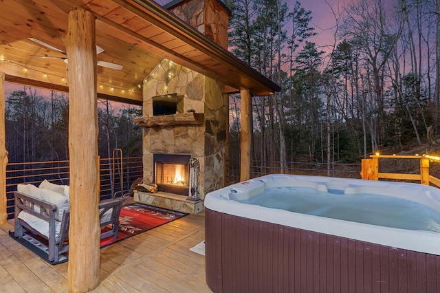 87 Lonesome Dove Path, Blue Ridge, GA 30513 - view of patio / terrace featuring an outdoor stone fireplace, a hot tub, and a deck