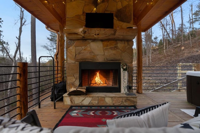 87 Lonesome Dove Path, Blue Ridge, GA 30513 - view of patio featuring an outdoor stone fireplace, a deck, and fence