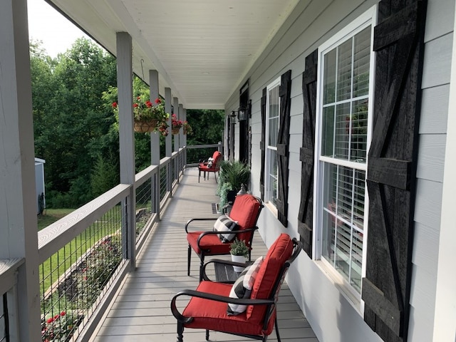 wooden deck featuring covered porch