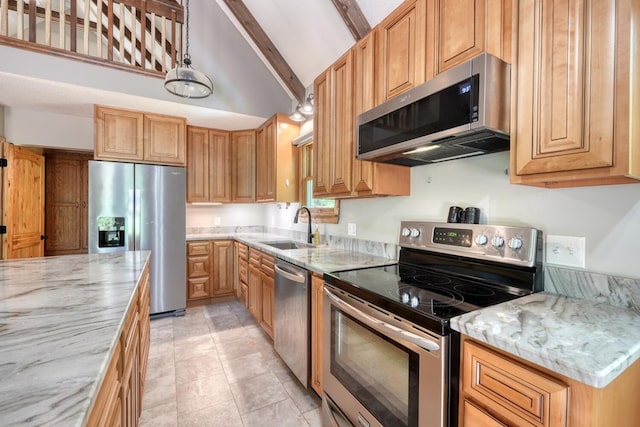 kitchen featuring appliances with stainless steel finishes, a sink, light stone countertops, beam ceiling, and pendant lighting