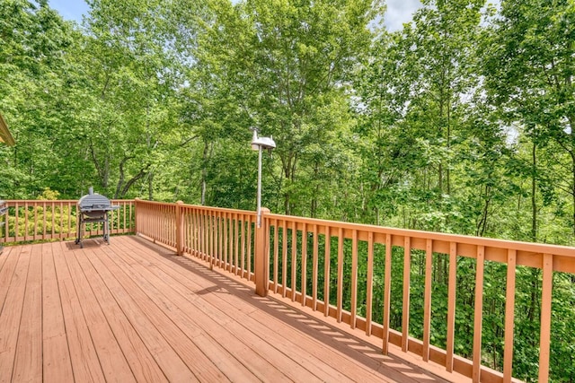 deck featuring a grill