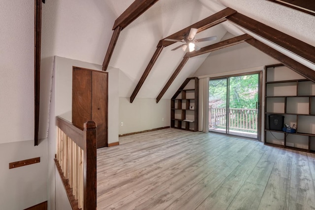 bonus room with wood finished floors and ceiling fan