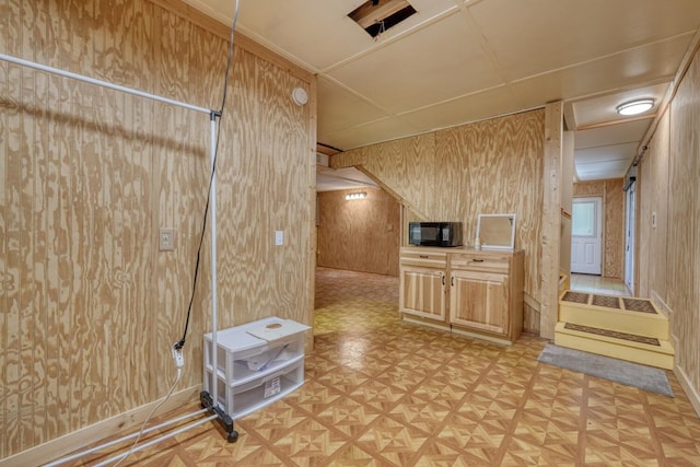 additional living space with wood walls