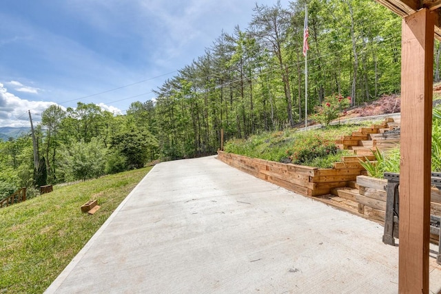 view of street featuring a wooded view