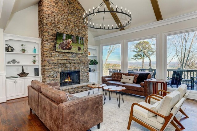 1492 Mcelroy Mountain Dr, Jasper, GA 30143 - living area with a fireplace, wood finished floors, a chandelier, built in features, and high vaulted ceiling