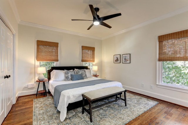 1492 Mcelroy Mountain Dr, Jasper, GA 30143 - bedroom featuring ornamental molding, baseboards, wood finished floors, a closet, and ceiling fan