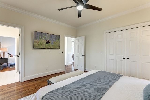 1492 Mcelroy Mountain Dr, Jasper, GA 30143 - bedroom with dark wood-style floors, crown molding, baseboards, a closet, and ceiling fan