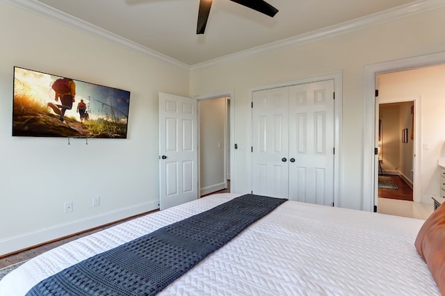1492 Mcelroy Mountain Dr, Jasper, GA 30143 - bedroom with crown molding, wood finished floors, baseboards, a closet, and ceiling fan