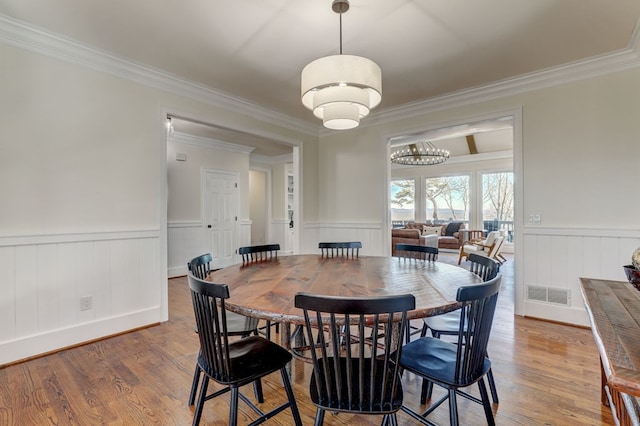 1492 Mcelroy Mountain Dr, Jasper, GA 30143 - dining area with a wainscoted wall, crown molding, and wood finished floors