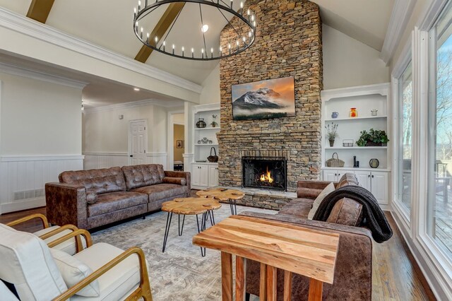 1492 Mcelroy Mountain Dr, Jasper, GA 30143 - living area with plenty of natural light, a fireplace, high vaulted ceiling, built in features, and a wainscoted wall