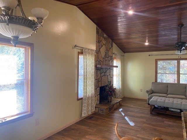 unfurnished living room with wood ceiling, lofted ceiling, baseboards, ceiling fan, and wood finished floors