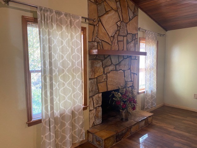 interior details featuring wood ceiling, wood finished floors, and baseboards