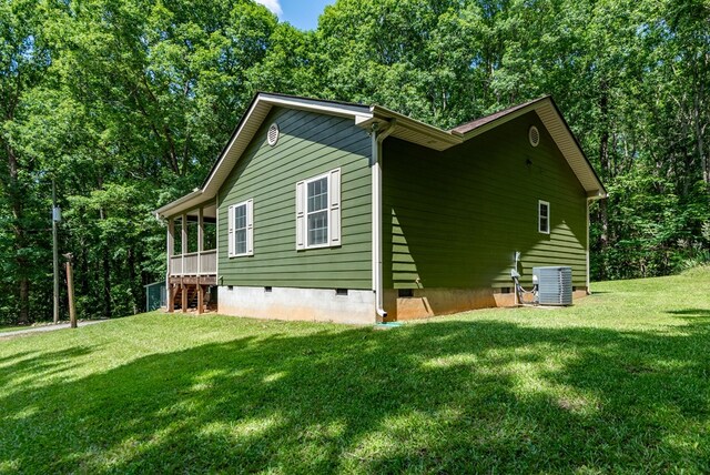 410 N Sharp Mountain Church Ln, Ball Ground, GA 30107 - view of home's exterior with crawl space, central air condition unit, and a yard