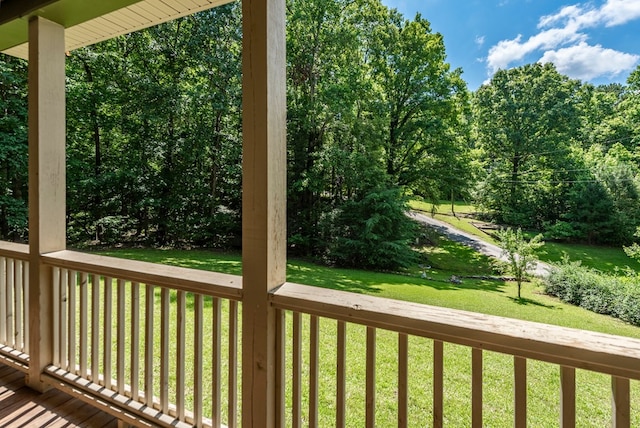 410 N Sharp Mountain Church Ln, Ball Ground, GA 30107 - deck featuring a yard and view of wooded area