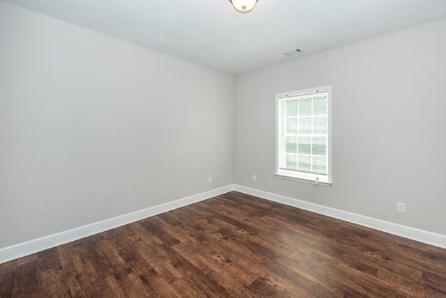 410 N Sharp Mountain Church Ln, Ball Ground, GA 30107 - empty room with baseboards and dark wood-style flooring