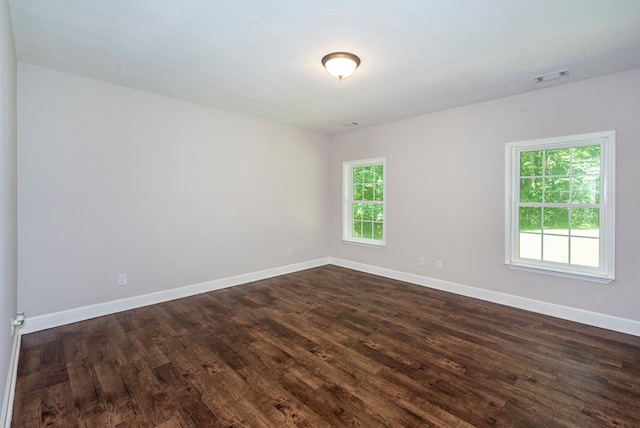 410 N Sharp Mountain Church Ln, Ball Ground, GA 30107 - empty room with dark wood finished floors and baseboards