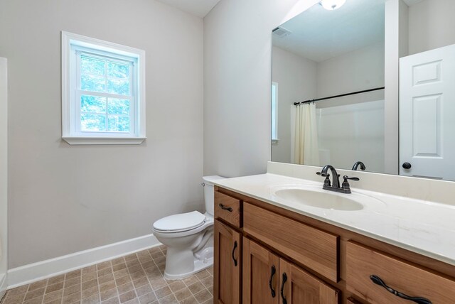 410 N Sharp Mountain Church Ln, Ball Ground, GA 30107 - bathroom featuring baseboards, vanity, toilet, and a shower with shower curtain