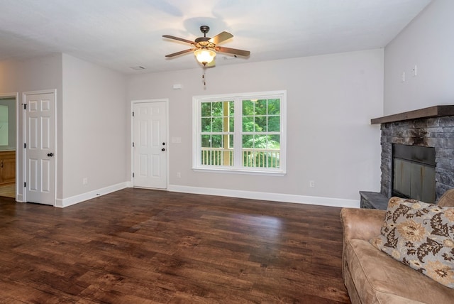 410 N Sharp Mountain Church Ln, Ball Ground, GA 30107 - unfurnished living room featuring ceiling fan, wood finished floors, baseboards, and a stone fireplace