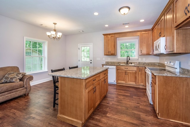 410 N Sharp Mountain Church Ln, Ball Ground, GA 30107 - kitchen featuring white appliances, dark wood-style floors, a sink, a breakfast bar area, and recessed lighting