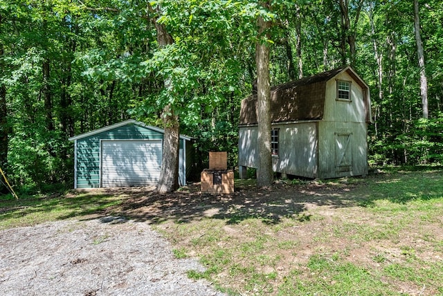 410 N Sharp Mountain Church Ln, Ball Ground, GA 30107 - view of shed featuring a forest view