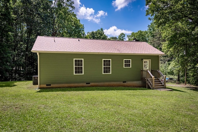 410 N Sharp Mountain Church Ln, Ball Ground, GA 30107 - rear view of house featuring crawl space, a lawn, central air condition unit, and roof with shingles