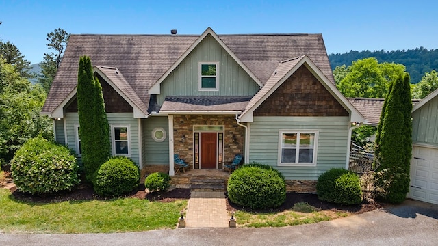 301 Shadow Mountain Rd, Dillard, GA 30537 - view of front facade featuring board and batten siding, stone siding, roof with shingles, and a garage