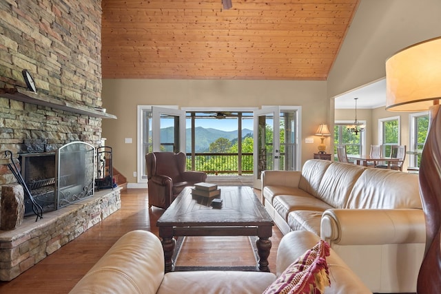 301 Shadow Mountain Rd, Dillard, GA 30537 - living room featuring high vaulted ceiling, a mountain view, wood finished floors, a chandelier, and healthy amount of natural light