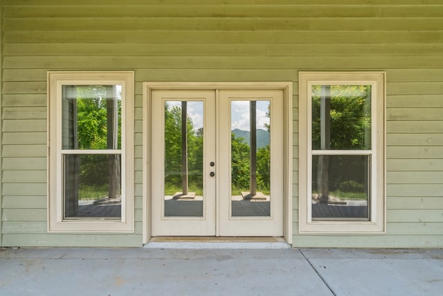 301 Shadow Mountain Rd, Dillard, GA 30537 - entryway with wood walls, concrete flooring, and french doors