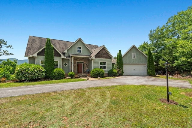 301 Shadow Mountain Rd, Dillard, GA 30537 - view of front of home with an outdoor structure, board and batten siding, a front lawn, and stone siding