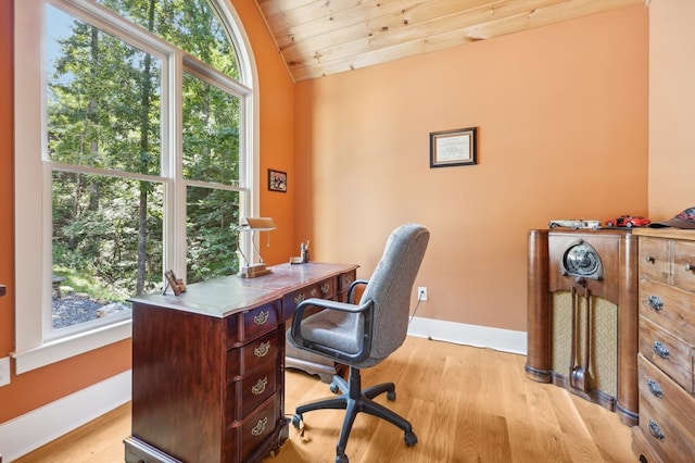 office space featuring wooden ceiling, vaulted ceiling, light hardwood / wood-style floors, and plenty of natural light