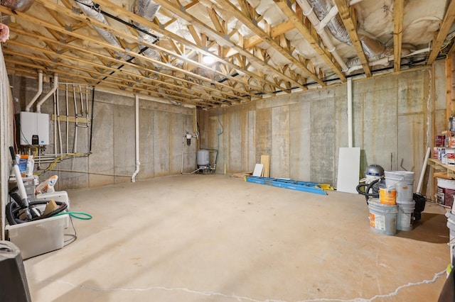 basement featuring tankless water heater