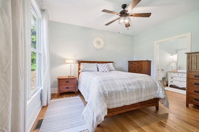 bedroom with light hardwood / wood-style floors and ceiling fan