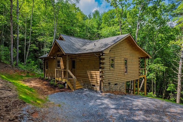 65 Christopher Dr, Ellijay, GA 30540 - view of front of house with a shingled roof, log exterior, and a wooded view