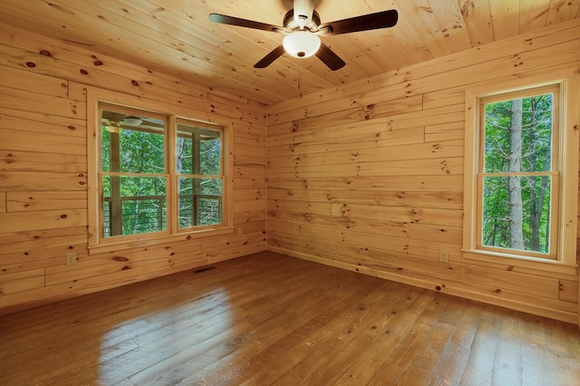 65 Christopher Dr, Ellijay, GA 30540 - spare room with hardwood / wood-style floors, wooden walls, healthy amount of natural light, and a ceiling fan