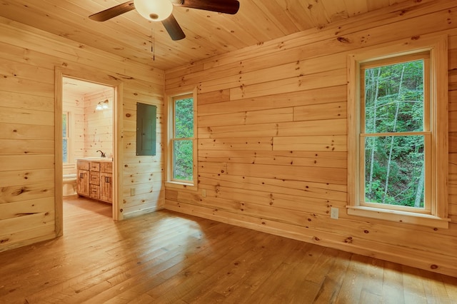 65 Christopher Dr, Ellijay, GA 30540 - unfurnished room with wood walls, electric panel, a ceiling fan, hardwood / wood-style floors, and a sauna / steam room