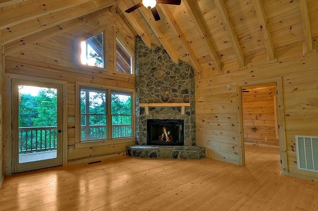 unfurnished living room featuring wooden ceiling, beam ceiling, visible vents, and hardwood / wood-style flooring