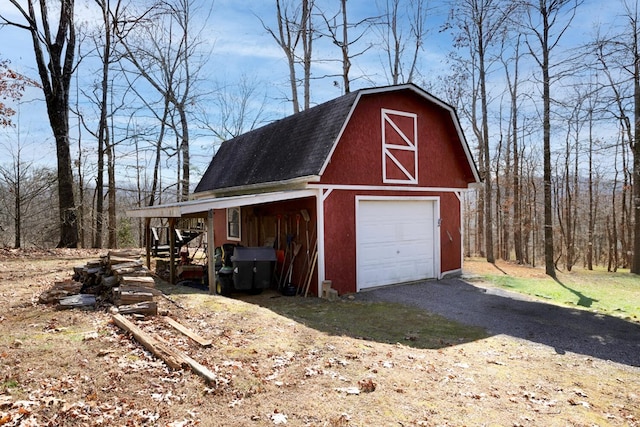 garage with a garage and driveway