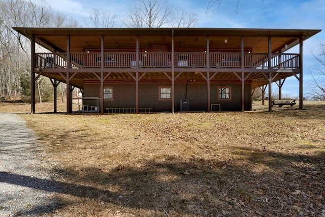 rear view of property featuring cooling unit