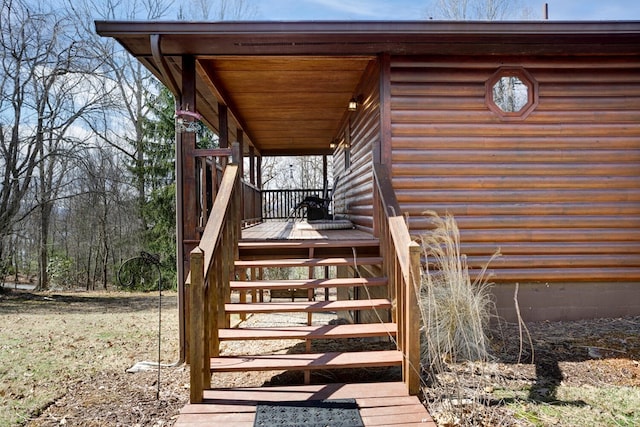 wooden deck featuring stairs