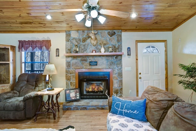 living room featuring ceiling fan, wood ceiling, vaulted ceiling, a fireplace, and wood finished floors