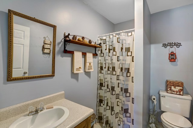 full bath featuring vanity, curtained shower, and toilet