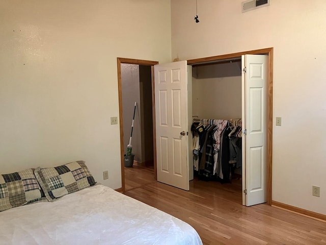47 Starry Night Path, Murphy, NC 28906 - bedroom with light wood-type flooring, a closet, and a high ceiling