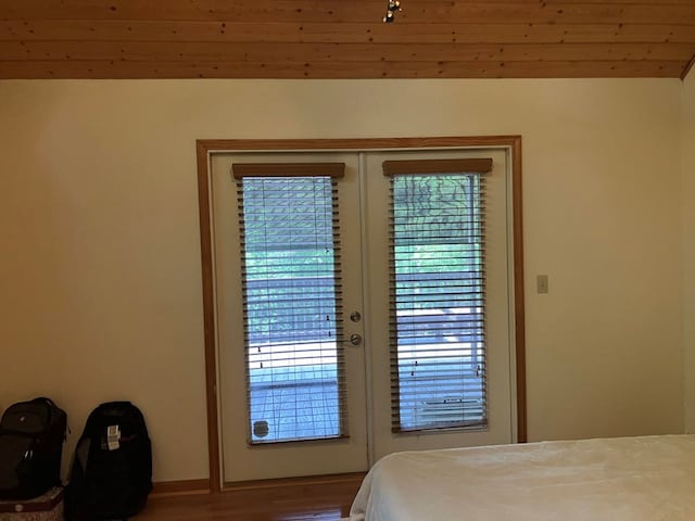 47 Starry Night Path, Murphy, NC 28906 - bedroom with multiple windows, wood finished floors, and french doors