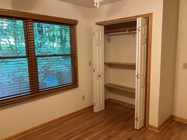 47 Starry Night Path, Murphy, NC 28906 - unfurnished bedroom featuring wood finished floors and a closet