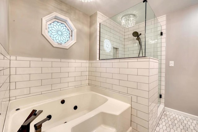 bathroom featuring tile patterned flooring and separate shower and tub