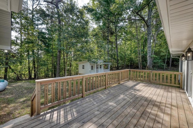 wooden deck featuring an outbuilding